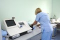 At a hospital laboratory. Lab technician performing analysis of blood samples with gas-electrolyte analyzer. Kiev Royalty Free Stock Photo