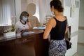 Nurse on duty speaks on the phone at the reception desk. Busy modern hospital with some of the best specialists and Medicare Royalty Free Stock Photo