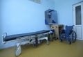 Hospital phoning room for patients: phone, wheelchairs and stretcher Royalty Free Stock Photo