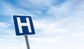 Hospital road sign with sky copy space Royalty Free Stock Photo