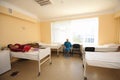 At a hospital room. Women patients lying on hospital beds