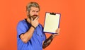 Hospital treatment. Coronavirus concept. Man bearded doctor with folder. Seek urgent medical attention. Medical Royalty Free Stock Photo