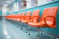 Hospital waiting room with rows of chairs for patients and visitors