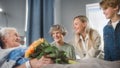Hospital Ward: Grandfather Resting in Bed, His Caring Beautiful Grandmother Sitting Beside, Happy Royalty Free Stock Photo