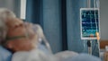 Hospital Ward: Portrait of Beautiful Elderly Woman Wearing Oxygen Mask Sleeping in Bed, Fully Royalty Free Stock Photo