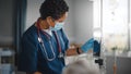 Hospital Ward: Professional Black Head Nurse Wearing Face Mask Does Checkup of Patient's Vitals Royalty Free Stock Photo