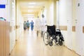 Hospital, wheelchair and unrecognizable people. Royalty Free Stock Photo