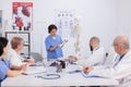 Hospital woman nurse presting bone structure using body anatomy skeleton