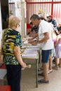HOSPITALET DE LLOBREGAT, Barcelona, Spain July 23th, 2023: Person at the polling station choosing their ballot papers.