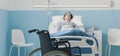 Hospitalized patient lying in bed and wheelchair Royalty Free Stock Photo