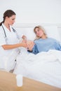 Hospitalized woman lying in sickbed Royalty Free Stock Photo