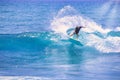 Man catching an ocean wave near the coast. Extreme water sports and outdoor active lifestyle. With copy space for text. - Image