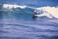 Man catching an ocean wave near the coast. Extreme water sports and outdoor active lifestyle. With copy space for text. - Image