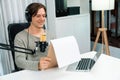 Host channel in broadcaster with script note reading to listeners. Pecuniary.
