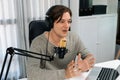 Host channel broadcaster talking show with script and smartphone. Pecuniary.
