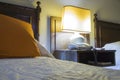 Hostel with beds, nightstand and lamp at night Royalty Free Stock Photo