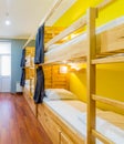 Hostel dormitory beds arranged in room Royalty Free Stock Photo