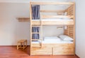 The hostel dormitory beds arranged in room Royalty Free Stock Photo