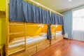 The hostel dormitory beds arranged in room Royalty Free Stock Photo