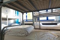 Hostel interior, bunk beds and linen, nobody Royalty Free Stock Photo