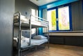 Hostel interior, metal bunk beds and linen, nobody Royalty Free Stock Photo