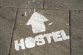 Hostel sign on the ground