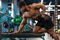 Hot african bodybuilder lifting barbell at gym Royalty Free Stock Photo