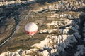 Hot air ballon and Colourful rock formations. Fairy Chimney or Multihead stone mushrooms. Phallic rock in Cappadocia, turkey.