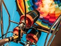 Hot air balloon, bright burning fire flame from gas burner equipment, close up from inside