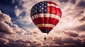 A hot air balloon, an airship flies in the clouds of the sky in the color of the flag of the United States of America. Royalty Free Stock Photo