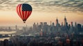 A hot air balloon, an airship flies over a big city in the colors of the flag of the United States of America.