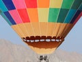 Hot air balloon as it is inflated for flight, closeup view of the colorful texture and fire burner engine Royalty Free Stock Photo