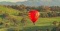 Hot air balloon avoiding power lines Royalty Free Stock Photo