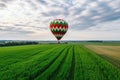 hot air balloon on the background of a green field and sun cloudy sky copy space Generative AI Royalty Free Stock Photo