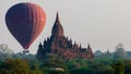 Hot air balloon behind temple in Bagan