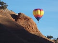 Hot Air Balloon beyond the Redrocks. Royalty Free Stock Photo