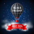 Hot air balloon black friday. Black retro airship with advertising sale and discount text, red tape banner, night sky Royalty Free Stock Photo