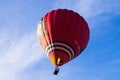 Hot air balloon with a burning burner scorched rises up