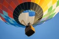 Hot air balloon in clear blue sky. Colorful balloon with basket lift up. Summer adventure and leisure. Aviation sport concept.