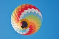 Hot air balloon, colorful aerostat on blue sky
