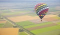 Hot air balloon with Dutch landscape from above