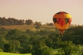 Hot Air Balloon Floats Above Rural Landscape Royalty Free Stock Photo