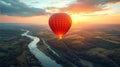 Hot air balloon flying above the river at beautiful sunset Royalty Free Stock Photo