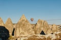 Hot air balloon flying in Goreme national park, fairy chimneys, Royalty Free Stock Photo