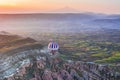 Hot air balloon flying over amazing landscape at sunrise. Cappadocia is known around the world as one of the best places to fly w Royalty Free Stock Photo