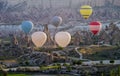 Hot air balloon flying over amazing landscape at sunrise, Cappadocia Turkey Royalty Free Stock Photo