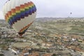 Hot Air balloon flying over a city