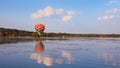 Hot air balloon flying over close to Kent lake in Michigan, USA