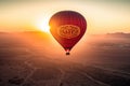 a hot air balloon flying over the desert at sunset. Generative Ai Royalty Free Stock Photo