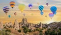 Hot air balloon flying over Goreme Open Air Museum in Cappadocia Turkey